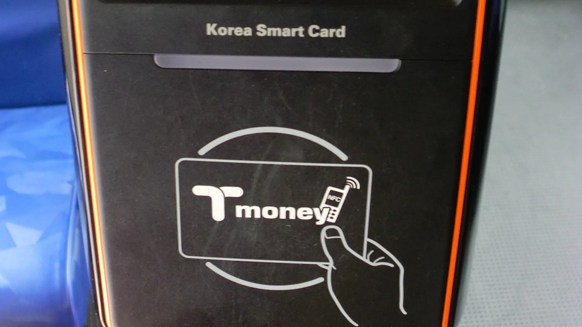 T-money tap-to-pay logo on a Korea Smart Card bus reader